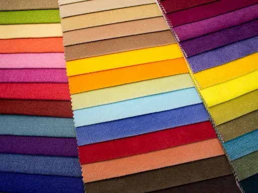 multi colored striped textile on brown wooden table